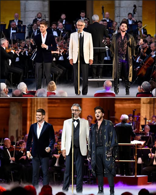 In the heart of Rome, where history breathes through every stone, Michael Bublé, Adam Lambert, and Andrea Bocelli stood side by side on one sacred stage, their voices blending into a single wave of emotion that silenced the night. Beneath ancient arches and golden light, pop met opera, soul met tradition, and something timeless was born. The crowd didn’t just witness music — they witnessed a miracle shaped in harmony. It was elegance without effort, drama without artifice, and power without noise. And for one unforgettable night, Italy became the voice of the world